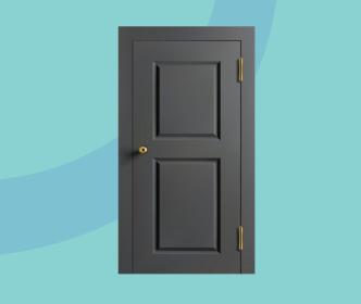 A dark grey wooden door