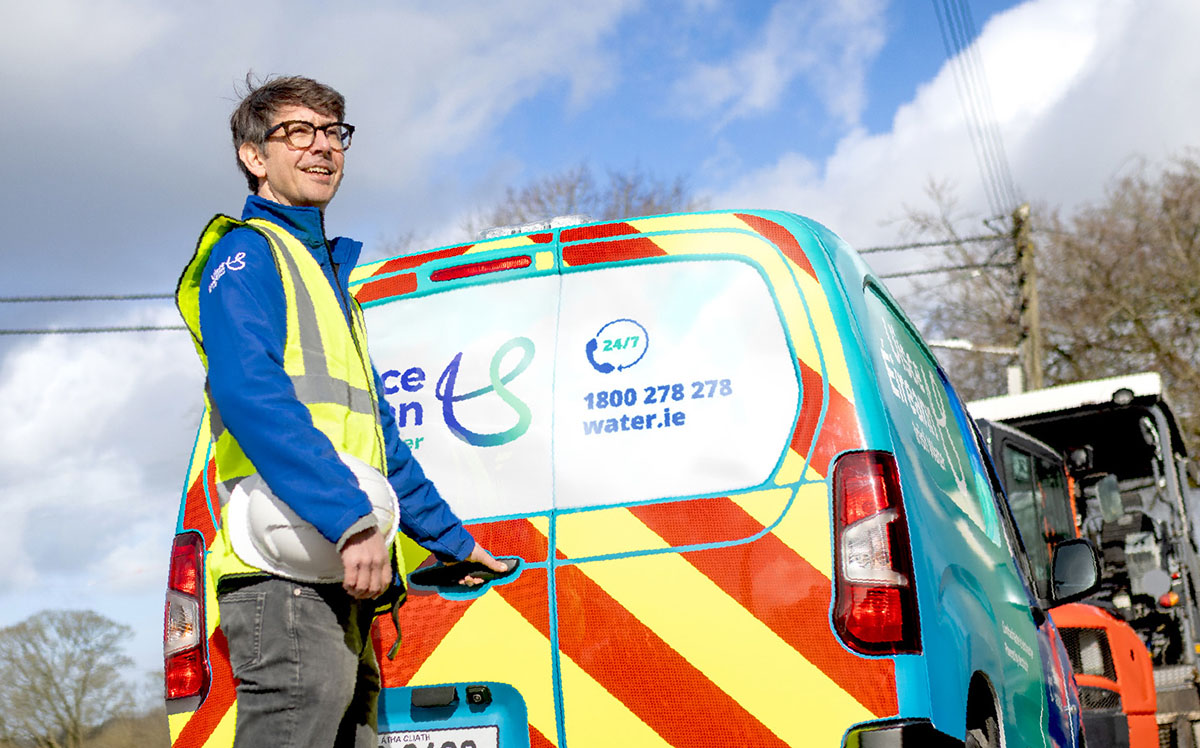 Uisce Eireann van drive standing beside an Uisce Eireann branded van