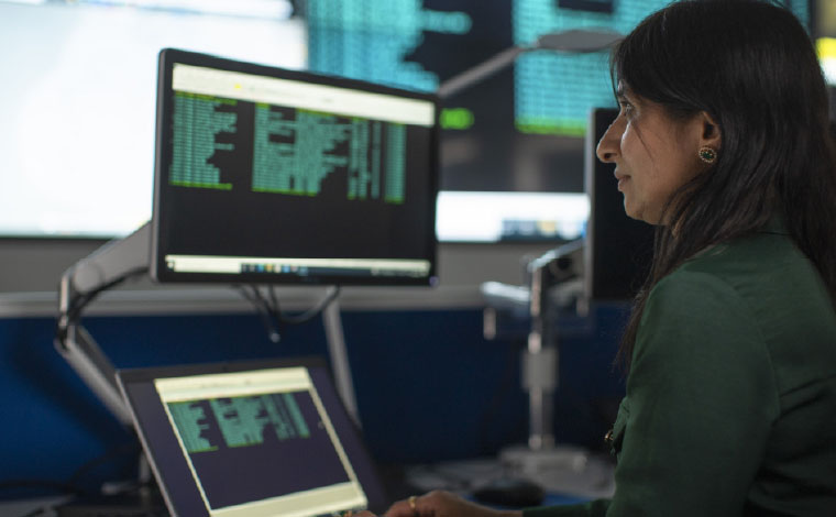 Uisce Eireann employee working in the National Operation centre monitoring water quality via computer