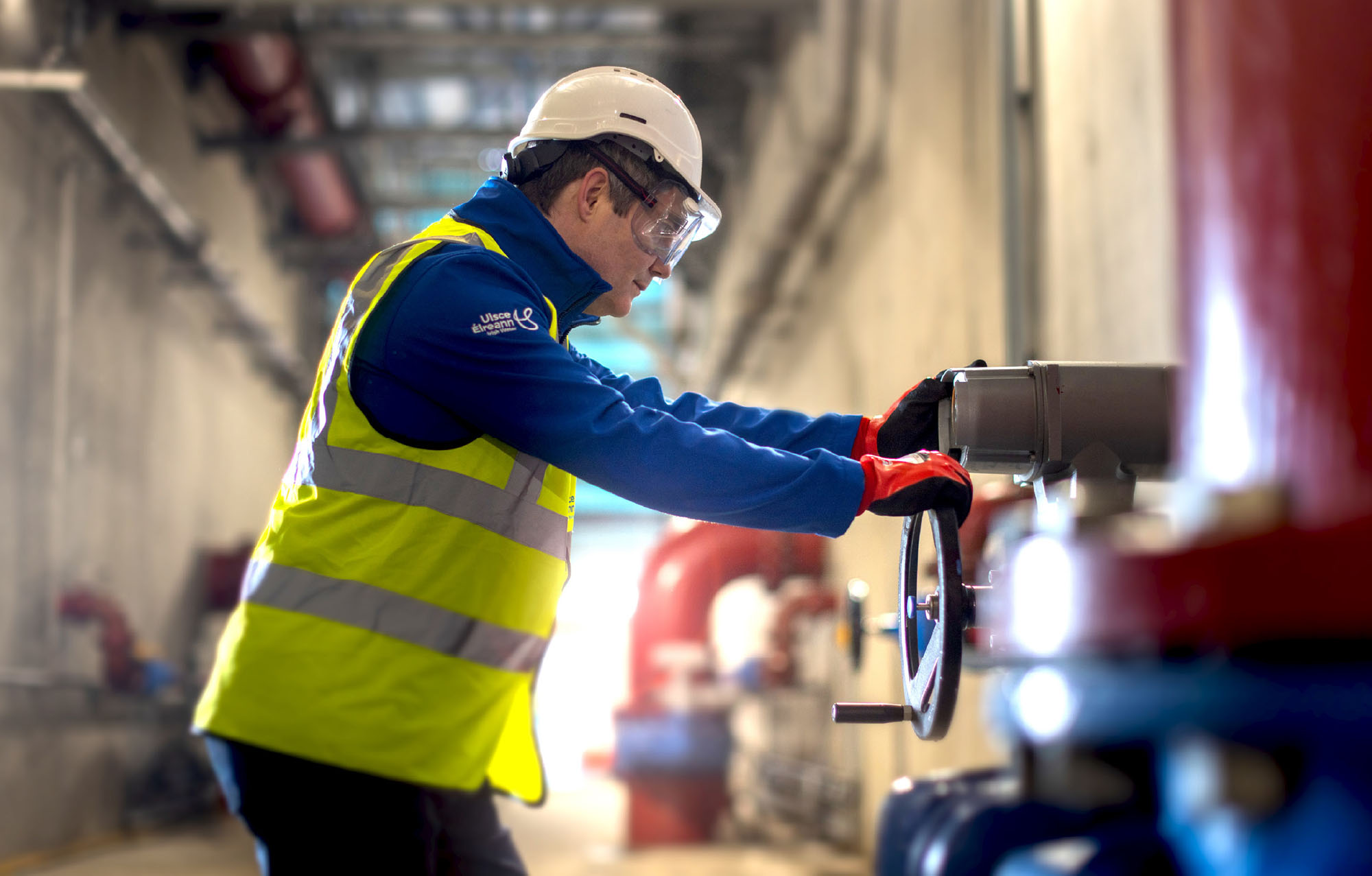 Water Plant operator, working with pressure valve and pipes