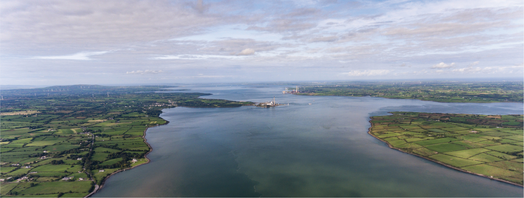 Aerial view of large estuary.