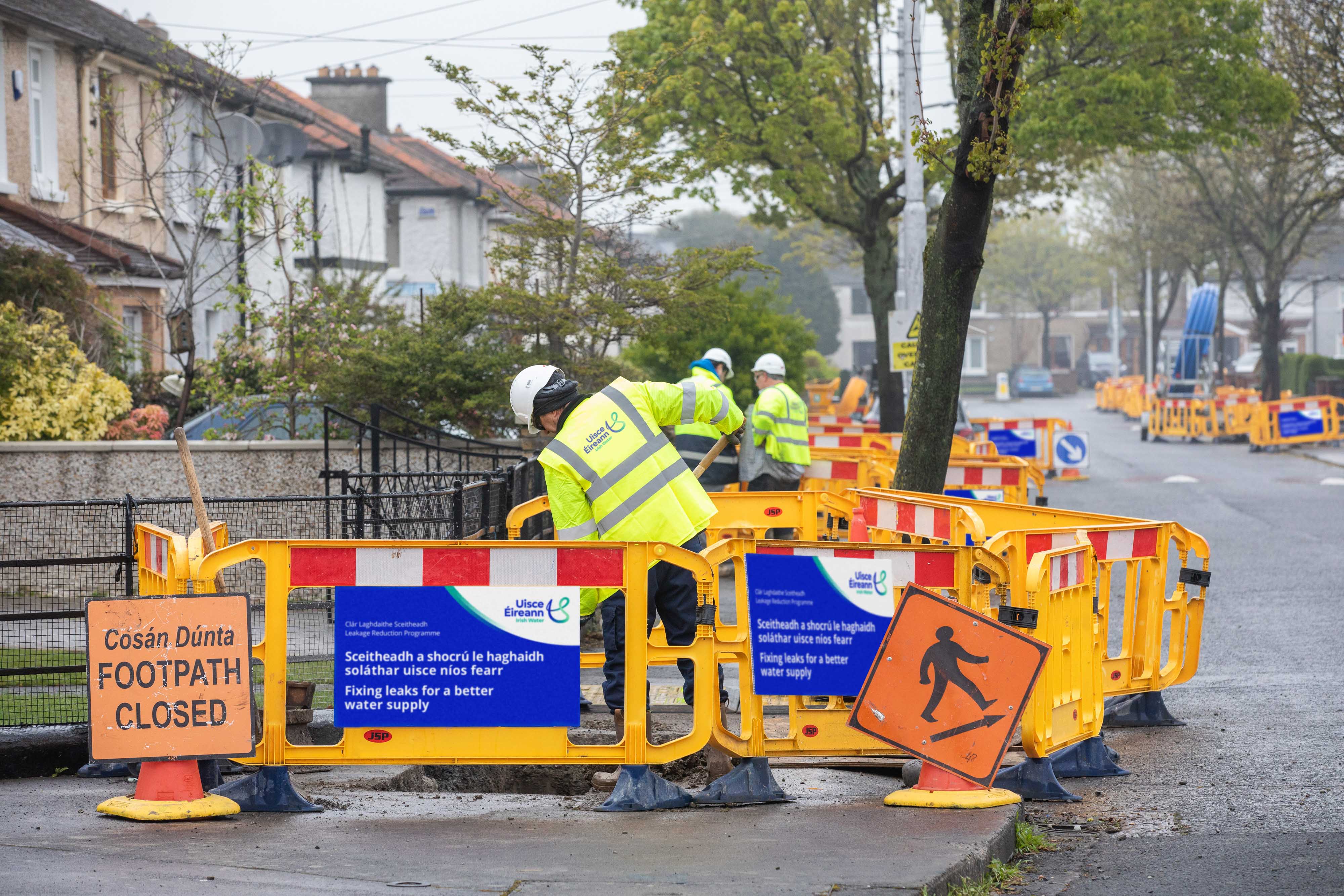 Uisce Éireann workers working on a residential street