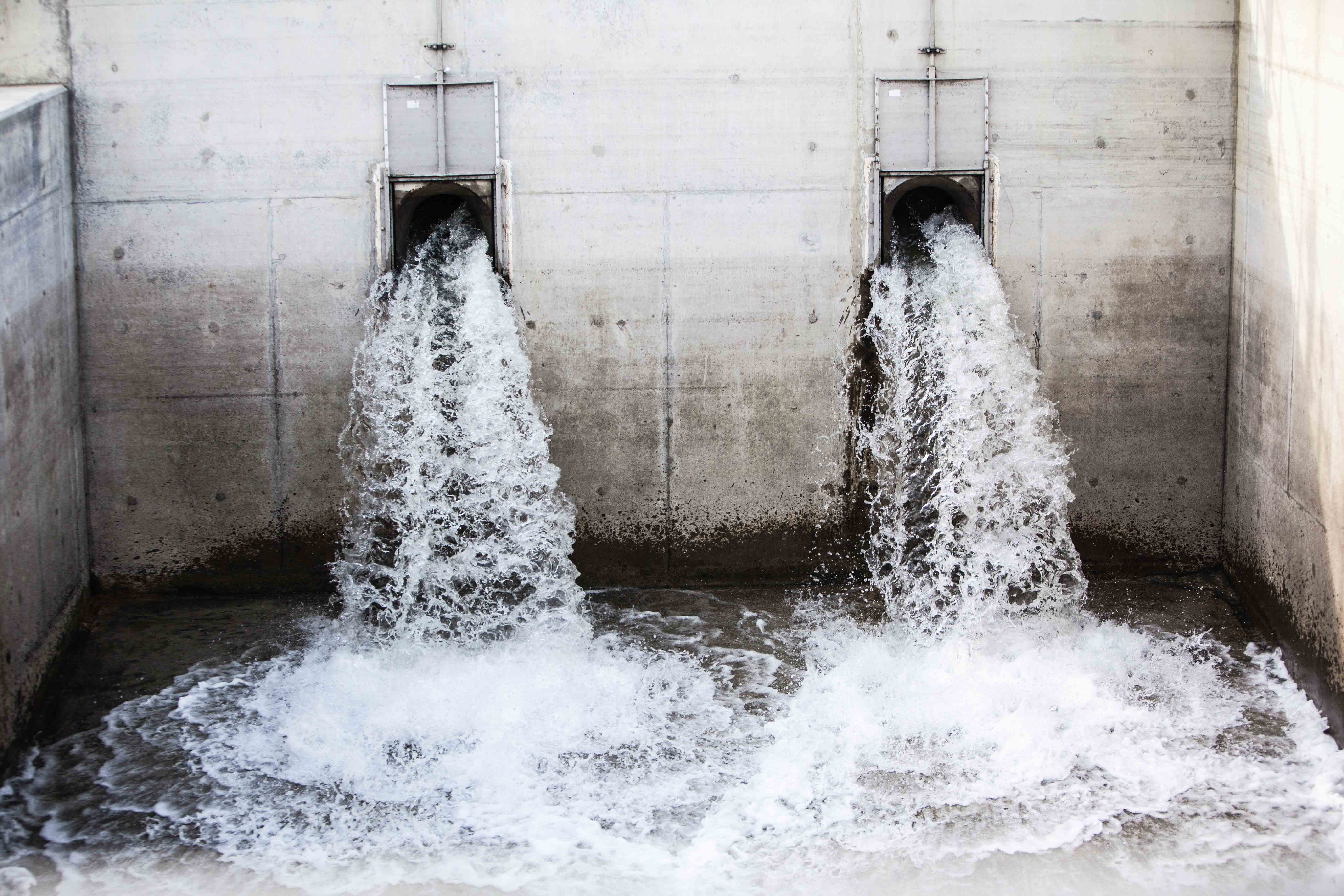 Wastewater flushing out of pipes at a wastewater plant