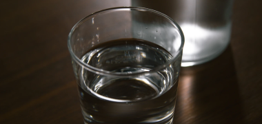 A single glass of water on a table