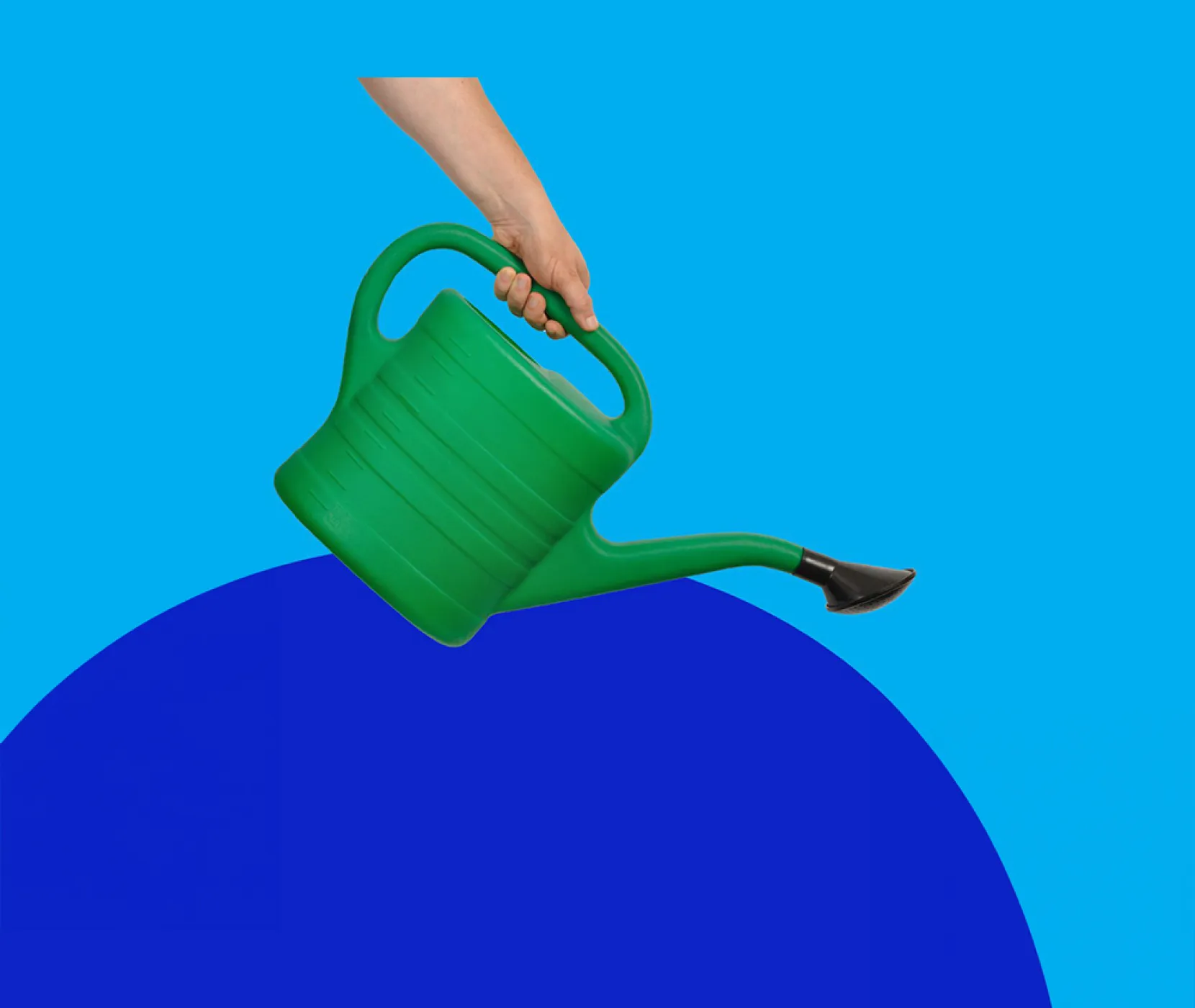 A person holding a green water pail