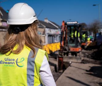 Lead engineer standing infront of road works by Uisce Éireann