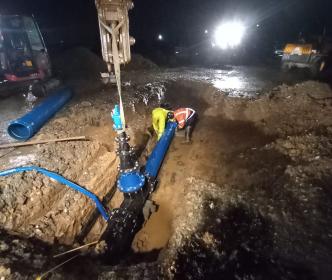 Uisce Éireann workers fixing water mains at night